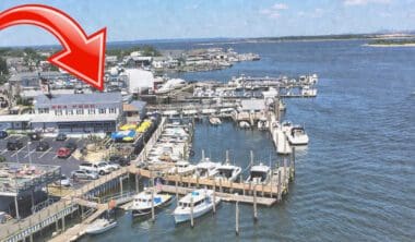 A red arrow pointing to the dock of a marina.