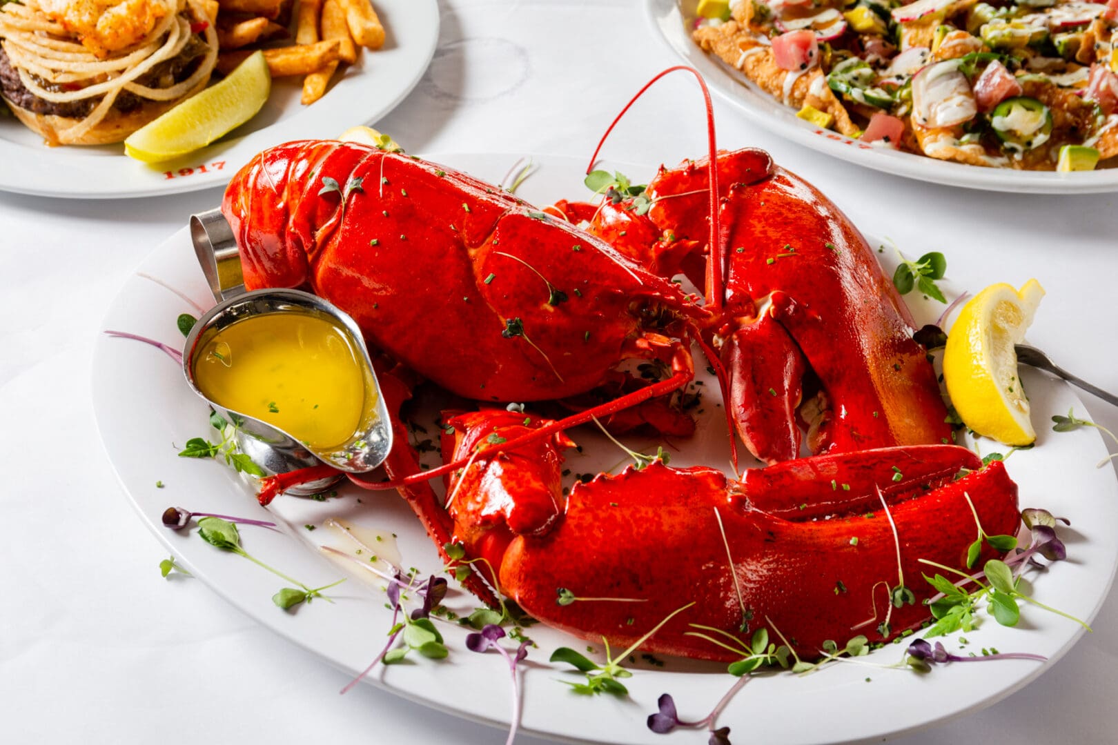 A Lobster in a Plate With Butter Sauce