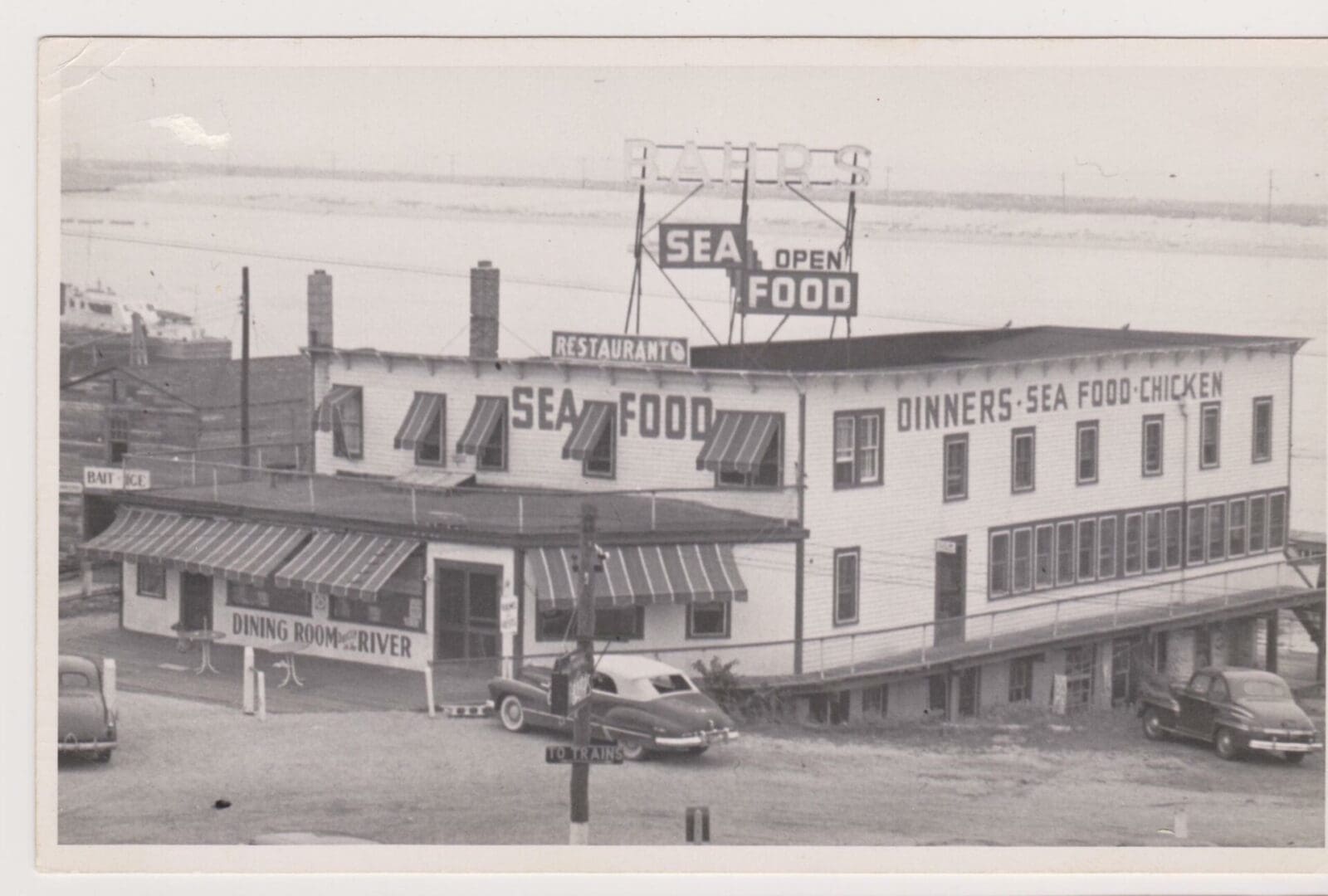 A black and white photo of an old restaurant.